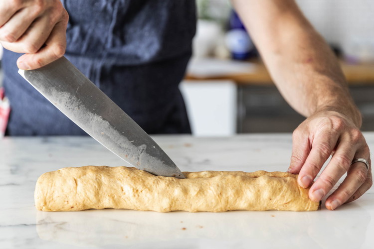 Image of Cut the log lengthwise in half.