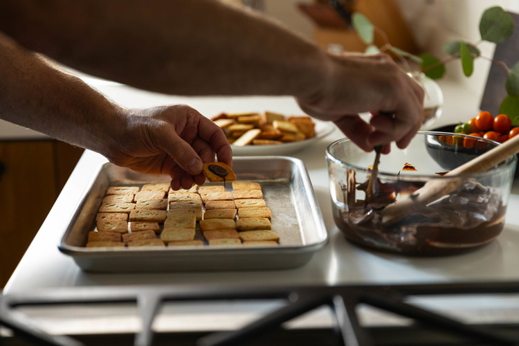 Image of Spread a heaping 1⁄2 teaspoon of the melted chocolate (2 grams) on a cookie and sandwich it with another. Repeat with the remaining chocolate and cookies. Let stand until the chocolate is firm. The sandwich cookies will keep in a...