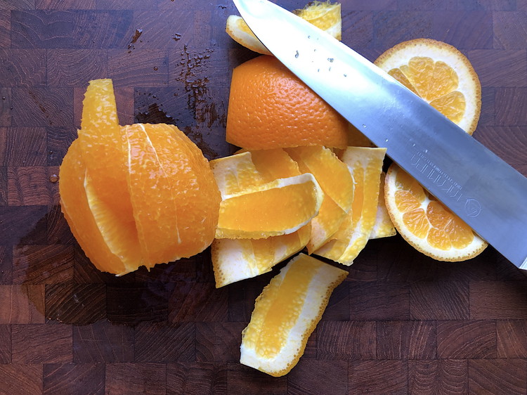 Image of Remove any pith you missed and then slice close to the membrane on each side to release the segments.