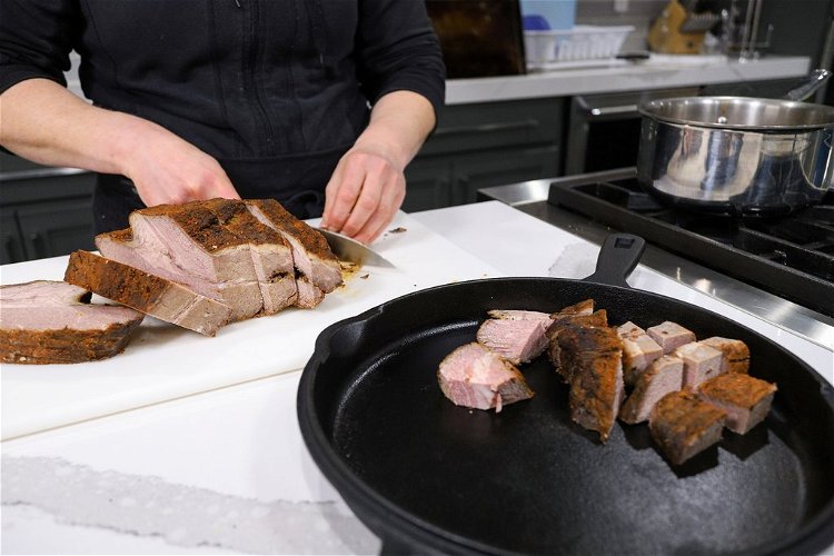 Image of Cut smoked brisket point into ½ inch to ¾ inch...