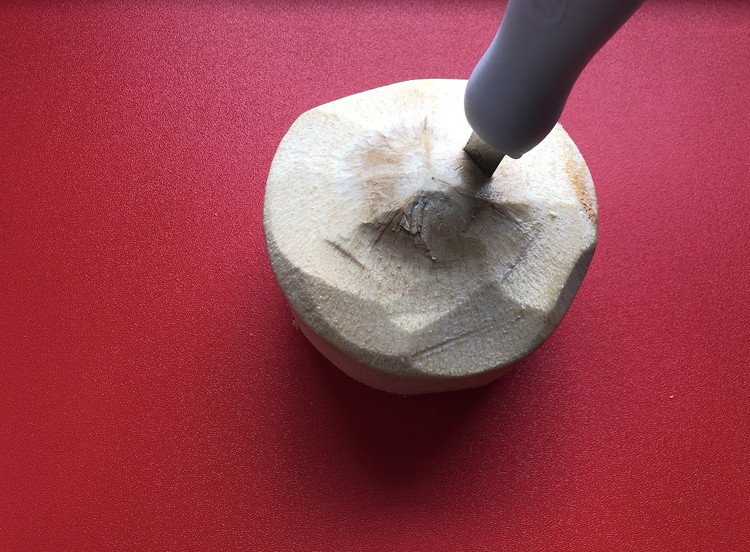 Image of Carefully but forcefully plunge the oyster knife into the coconut.
