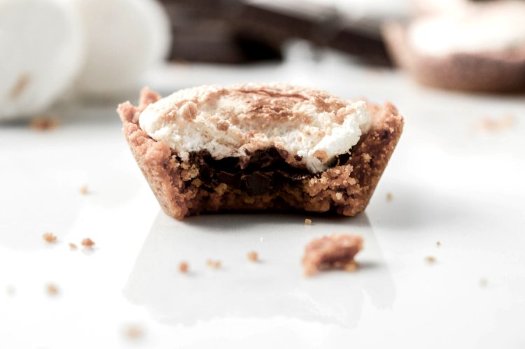 Image of Add a marshmallow to each cup and return to the...