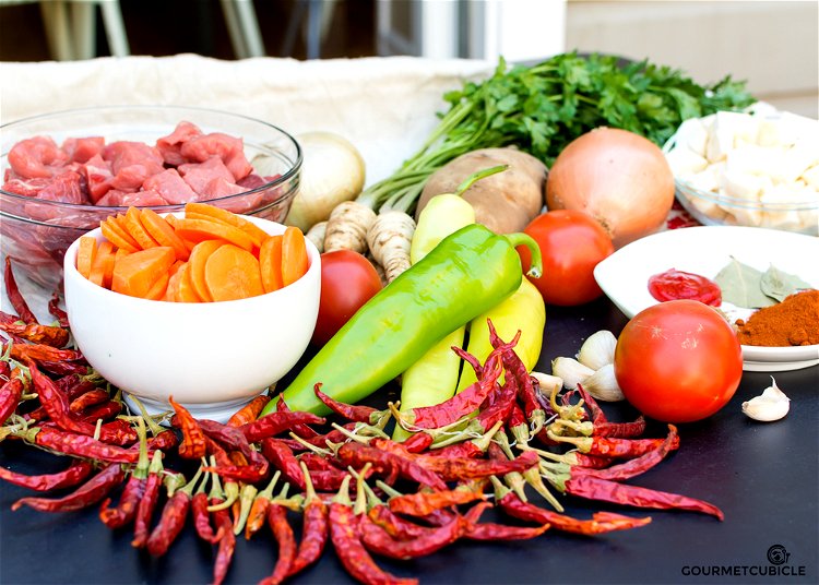 Image of In a cast iron Dutch oven, heat the paprika seed...