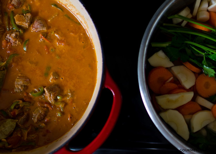 Image of Add the root vegetables (carrots, parsnips, celery and potatoes) and the tied parsley leaves to the pot. Add 4-5 cups of hot water to cover by an inch or two.