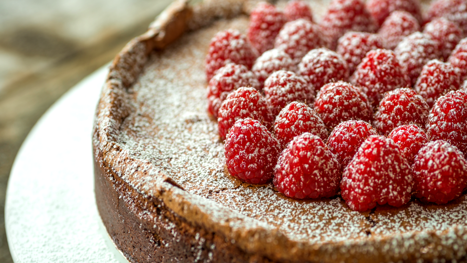 Image of Decadent Flourless Chocolate Cake with Raspberries