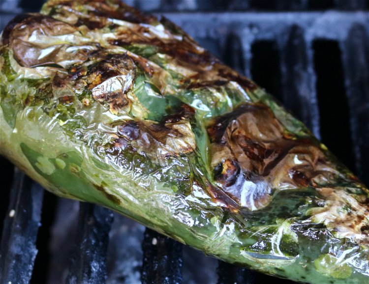 Image of Char pepper on a hot grill until skin separates from...