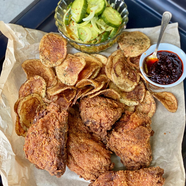 Image of When the fried chicken is ready, serve it with  Bernise Potatoes,  Bread and Butter Pickles and Harissa Honey on the side.