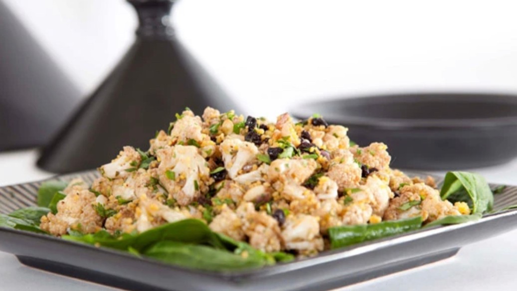 Image of CAULIFLOWER, COUSCOUS AND PINE NUT SALAD WITH POMEGRANATE DRESSING