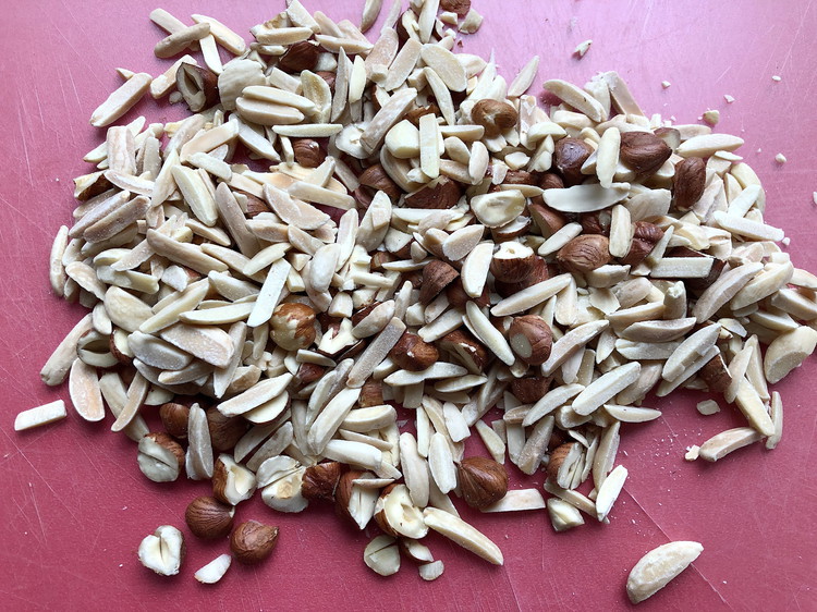 Image of On a small sheet tray scatter the nuts and place them in the oven. Allow to toast for for 10-20 minutes (depends on how quickly your oven heats), until fragrant and lightly brown. Remove to a bowl to cool and...