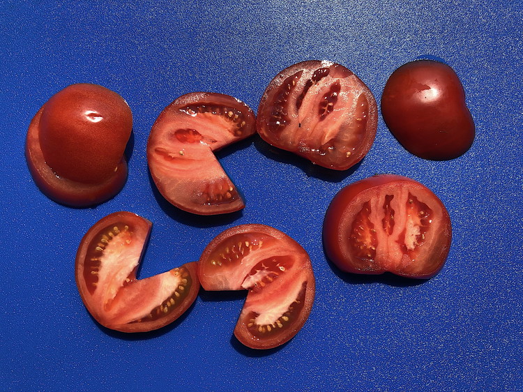Image of Place the tomatoes on a cutting board stem side down. Using a sharp knife (you can also use a serrated knife but the edge won't be quite as clean), cut them into thick slices, removing any bits of tough and...