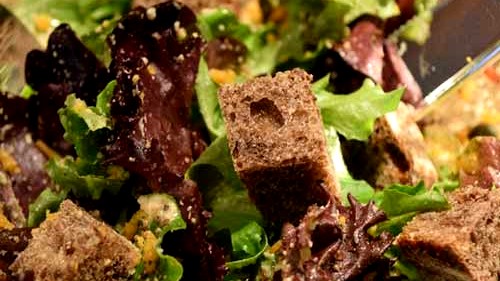 Image of Vegan Oil Free Caesar Salad with Mixed Baby Greens and Vegan Parmesan Cheese