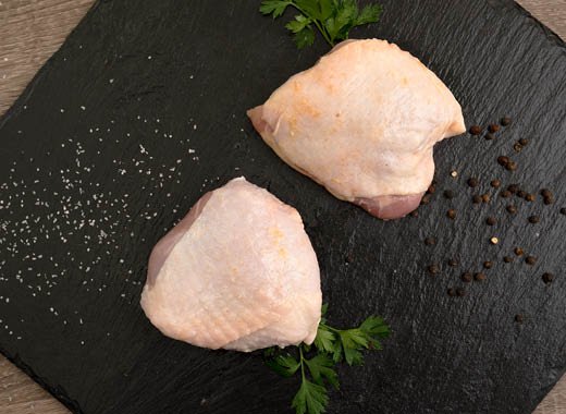 Image of Trim any excess skin from the chicken thighs.
