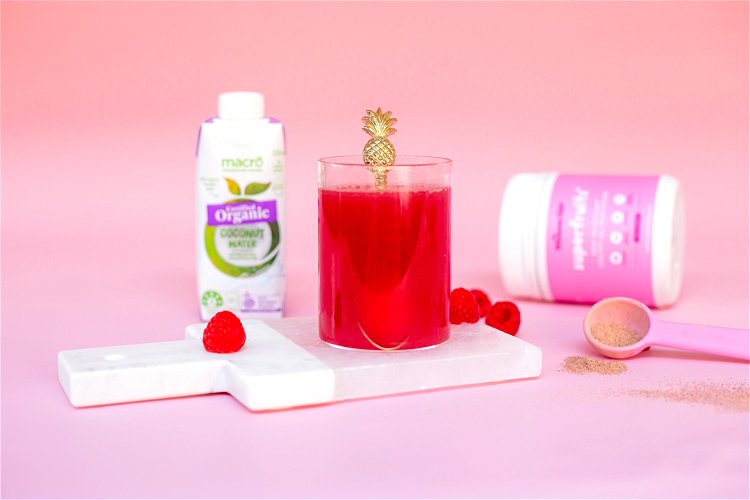 Image of In a small glass, combine coconut water and Superfruits+ powder until well combined.