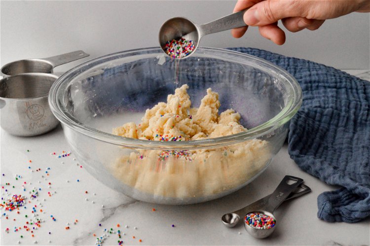 Image of Next, carefully fold the sprinkles into the dough. (Note, don’t...