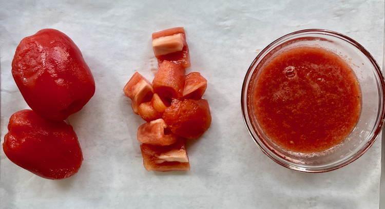 Image of Once cool enough to handle, remove the tomato skins.