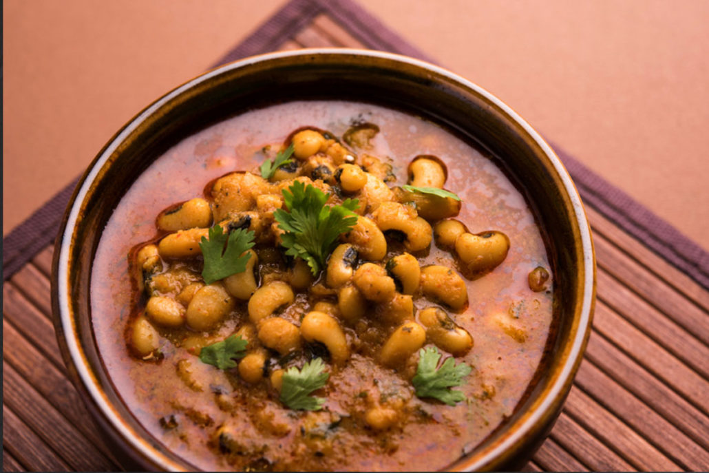 Slow Cooked Vindalho of Kipfler Potatoes, Black-Eyed Beans, Red Peppers & Tempeh