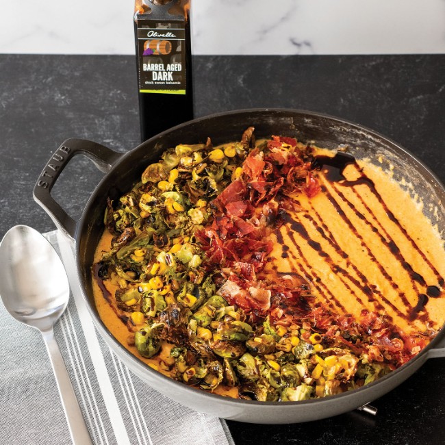 Image of CREAMY POLENTA WITH CRISPY PANCETTA, BRUSSEL SPROUTS, AND CORN