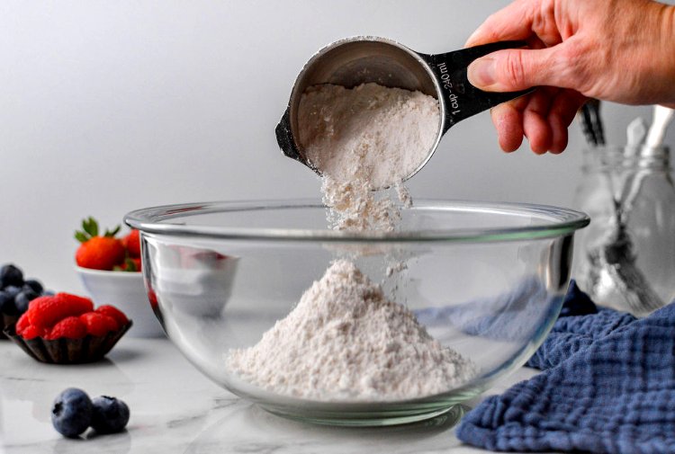 Image of In a medium sized mixing bowl, whisk together the flour,...