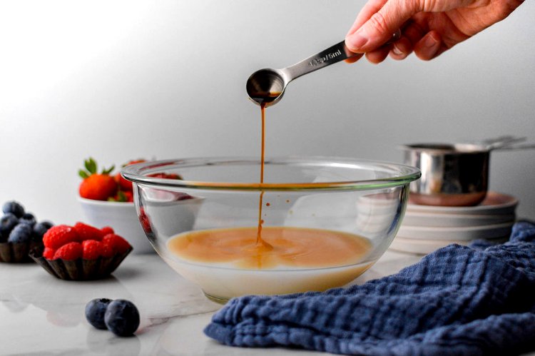 Image of In a separate bowl, grab you liquid measuring cup and...