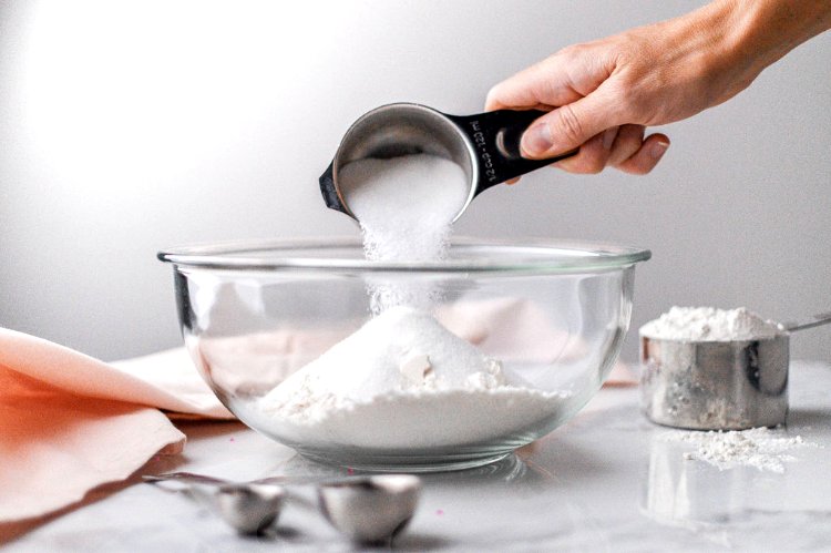 Image of In a medium sized mixing bowl, combine flour, sugar, baking...