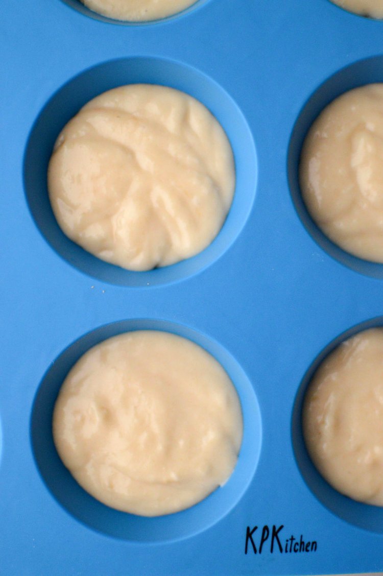 Image of Divide the cupcake batter evenly, filling each cavity roughly 2/3...