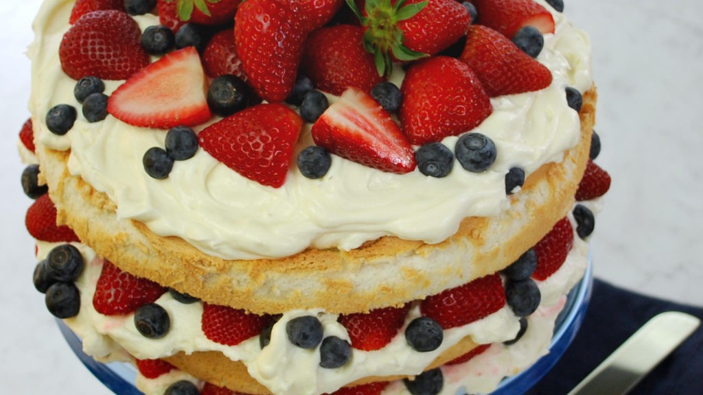 Image of Angel Food Cake with Heavenly Frosting and Berries