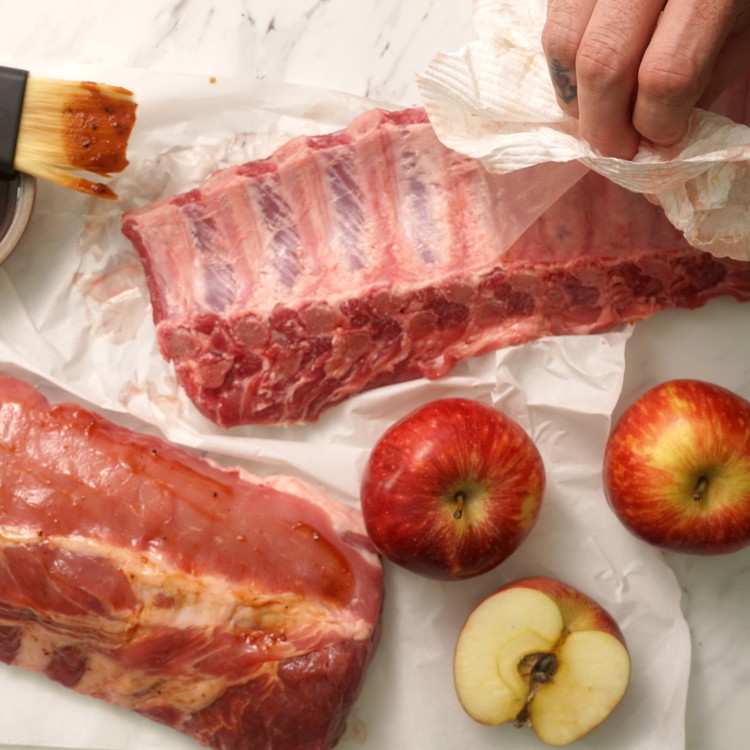 Image of Remove membrane from the back of the rib by scraping up the edge with a knife and pulling off with a paper towel