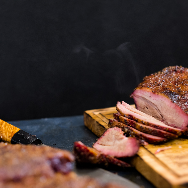 Image of Remove brisket and keep warm. Strain cooking juices; transfer to...
