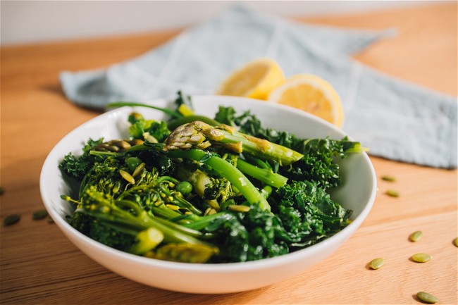 Image of Steamed Greens with Pumpkin Seed and Garlic Butter