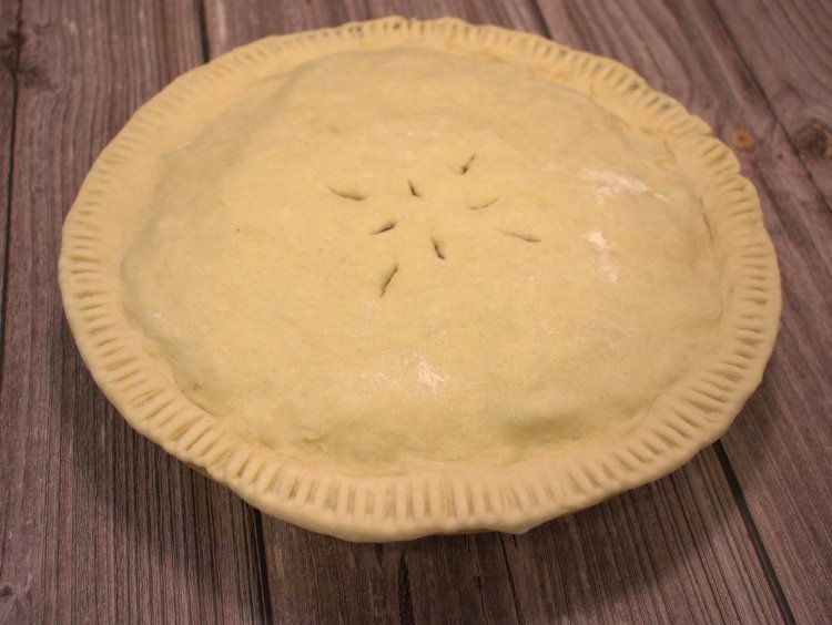 Image of Place one uncooked pie crust into the bottom of a...