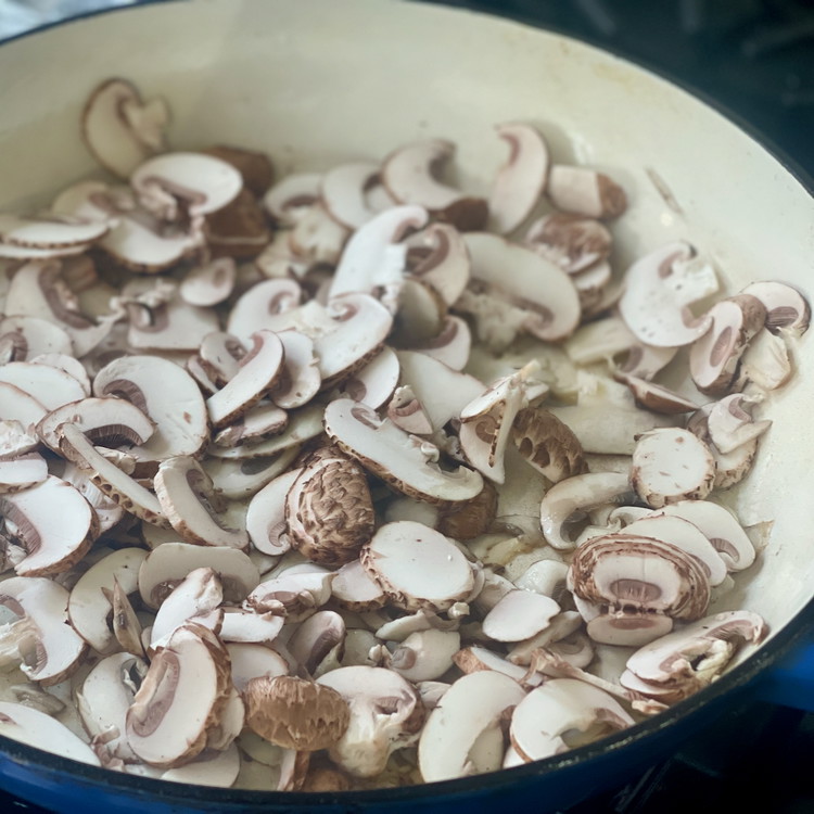 Image of Heat a heavy bottomed skillet or dutch oven (10”-12” wide) to very hot and add the olive oil and mushrooms in a shallow layer.  Leave the mushrooms without touching them until the edges are well browned.