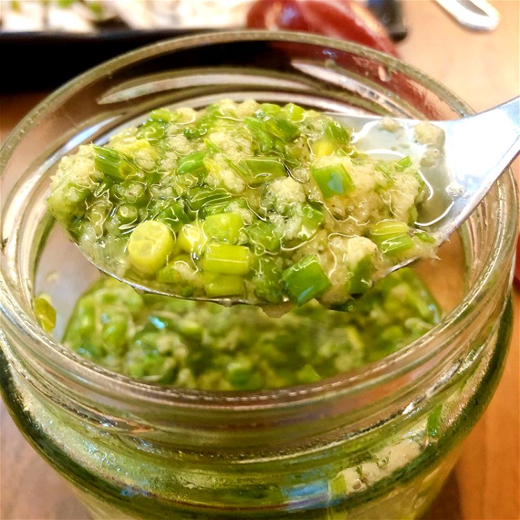 Image of Prepare GINGER SCALLION SAUCE: a. Combine chopped scallions and grated ginger...