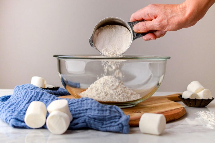 Image of In a medium sized mixing bowl, combine flour, sugar, baking...