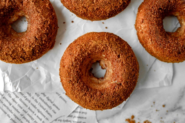 Image of Once the donuts have cooled, roll each donut in the...