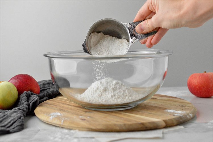 Image of In a medium sized mixing bowl, take your KPKitchen Measuring...
