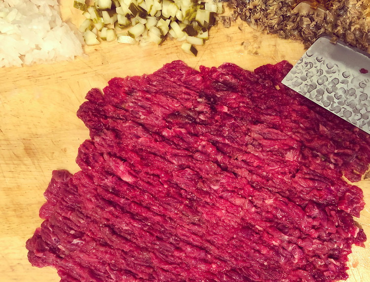 Image of Turn the cutting board 90 degrees, season with a few big pinches of OMG, and cut the slices again. Continue to chop the steak from different angles until the texture is to your liking. Some people prefer small cubes, I...