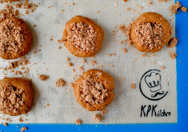 Image of Fill each hole with cinnamon streusel topping.