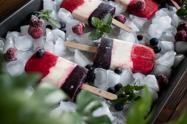 Image of Kid-friendly, Red, White and Blue Fruit and Yogurt Popsicles