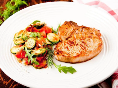 Image of Garlic & Rosemary Boneless Pork Chops With Arugula Salad