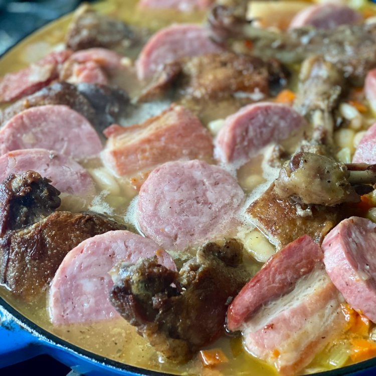 Image of Arrange the rendered bacon/salt pork, duck confit, and garlic sausage...