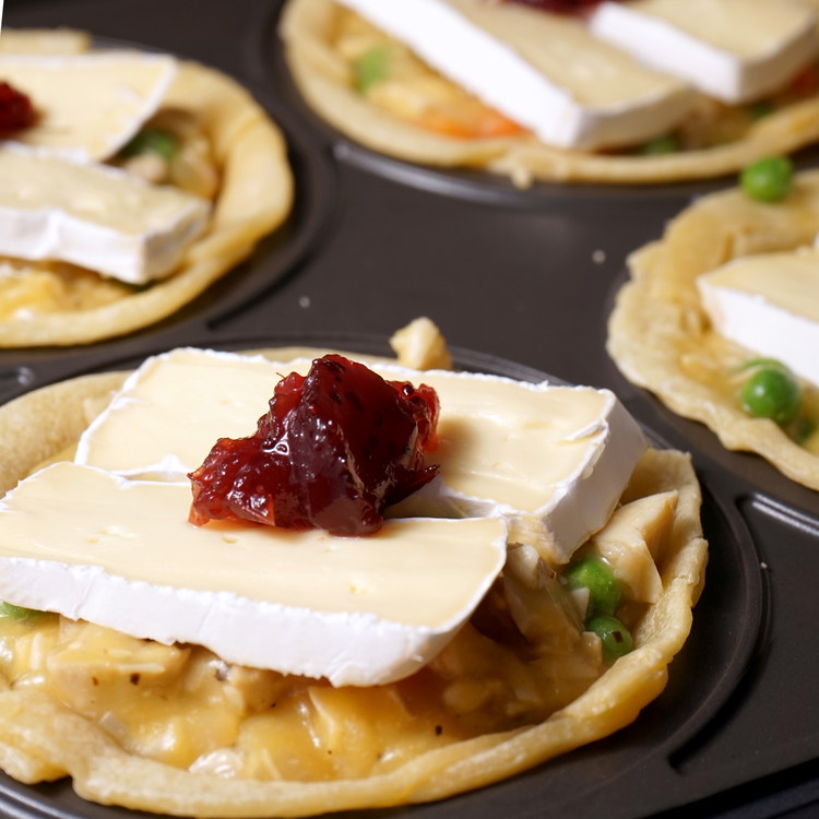 Image of add two slices of brie and a dollop of cranberry sauce.