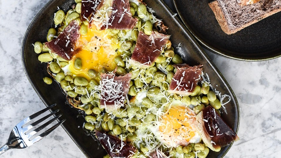 Image of Baby broad beans with Iberian Ham, fried egg and Manchego cheese