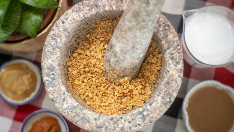 Image of 1. Use KROK to grind the roasted peanuts to a...