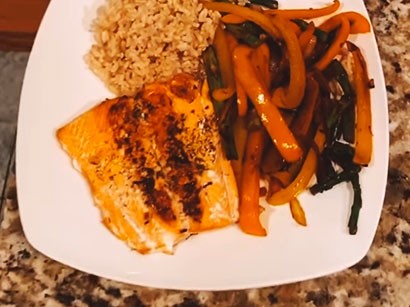 Image of Perfectly Seasoned Salmon over Rice, Asparagus and Peppers