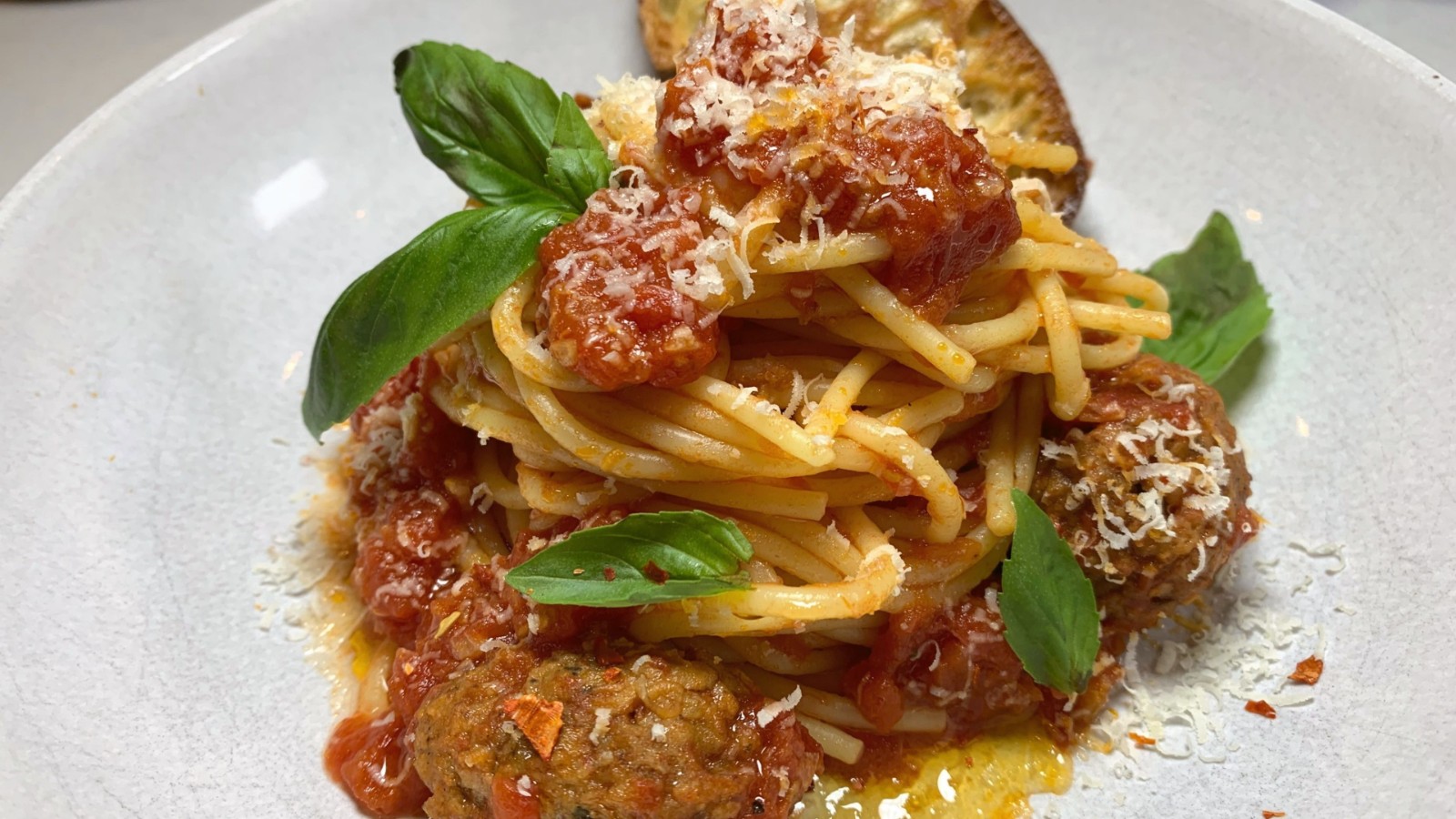 Image of Spaghetti and Meatballs, Crostini and Arugula Salad