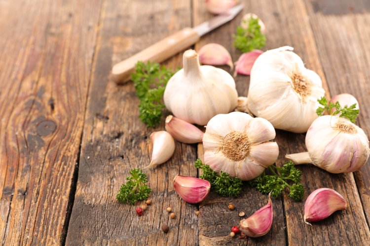 Image of Separate the cloves of garlic and drop them into a...