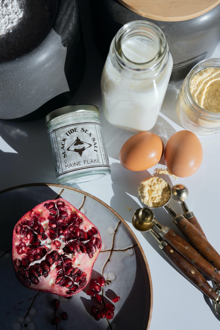 Image of While the batter sits, heat the crepe pan on medium low heat. In small batches, add a cup or so of pomegranate seeds to the batter. Gently mix with a rubber spatula—you want some of the seeds, but not too many,...