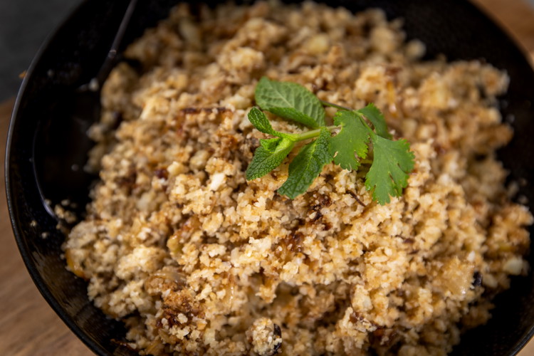 Image of Place lid on pan and reduce heat. Allow to steam through for approx. 5 mins. Using a fork, fluff the rice and serve!