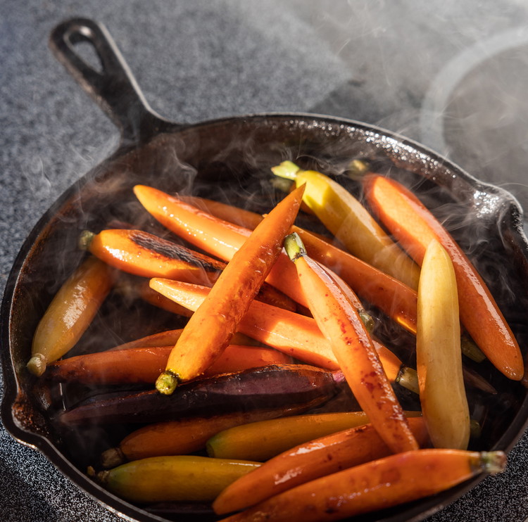 Image of Add the carrots to the pan and let sit for a minute or so until some color begins developing on the carrots. Stir the carrots (so different pieces are touching the bottom of the pan) and repeat this process a...