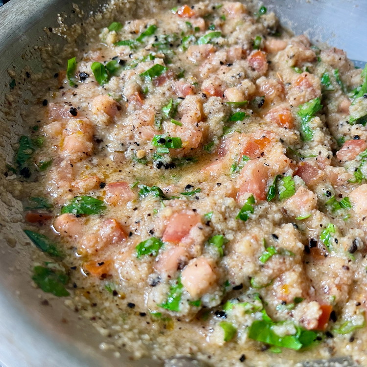 Image of Add the Lemon juice, tomato dice, breadcrumbs to heat through.  Remove from heat and fold into the parsley.